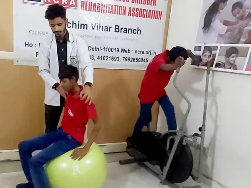Children using mobility and exercise equipment at the Paschim Vihar branch