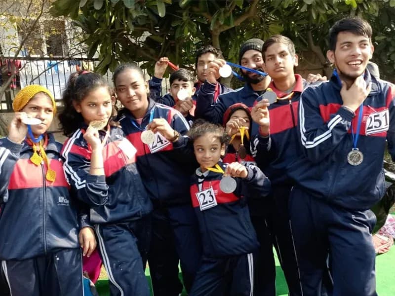 Children with medals from a sports day event