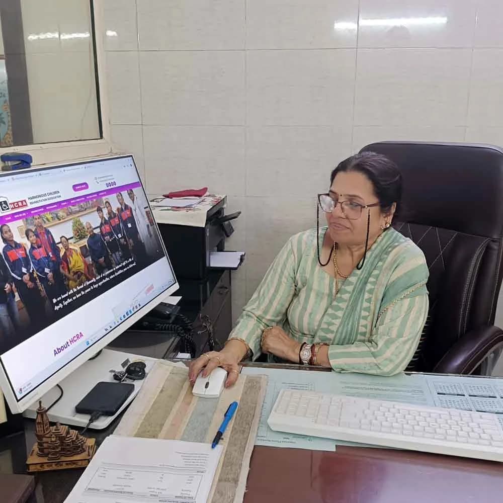 President of HCRA at her desk at the Kalkaji head office